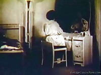 A woman is sitting at her dressing table, wearing a night gown. She drops it partly, showing her bare breasts. Then she lies down on the bed to be joined a little later by a guy who licks her pussy and then fucks her.
