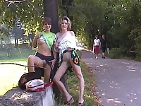 Two naughty lovers of hot public exposing tease strangers in the park