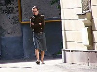 Amateur in eyeglasses pissing outdoors right through her jeans skirt